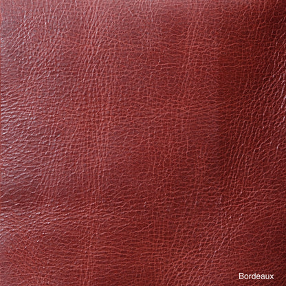 Close-up of Bordeaux leather showing its color, grain, and texture.