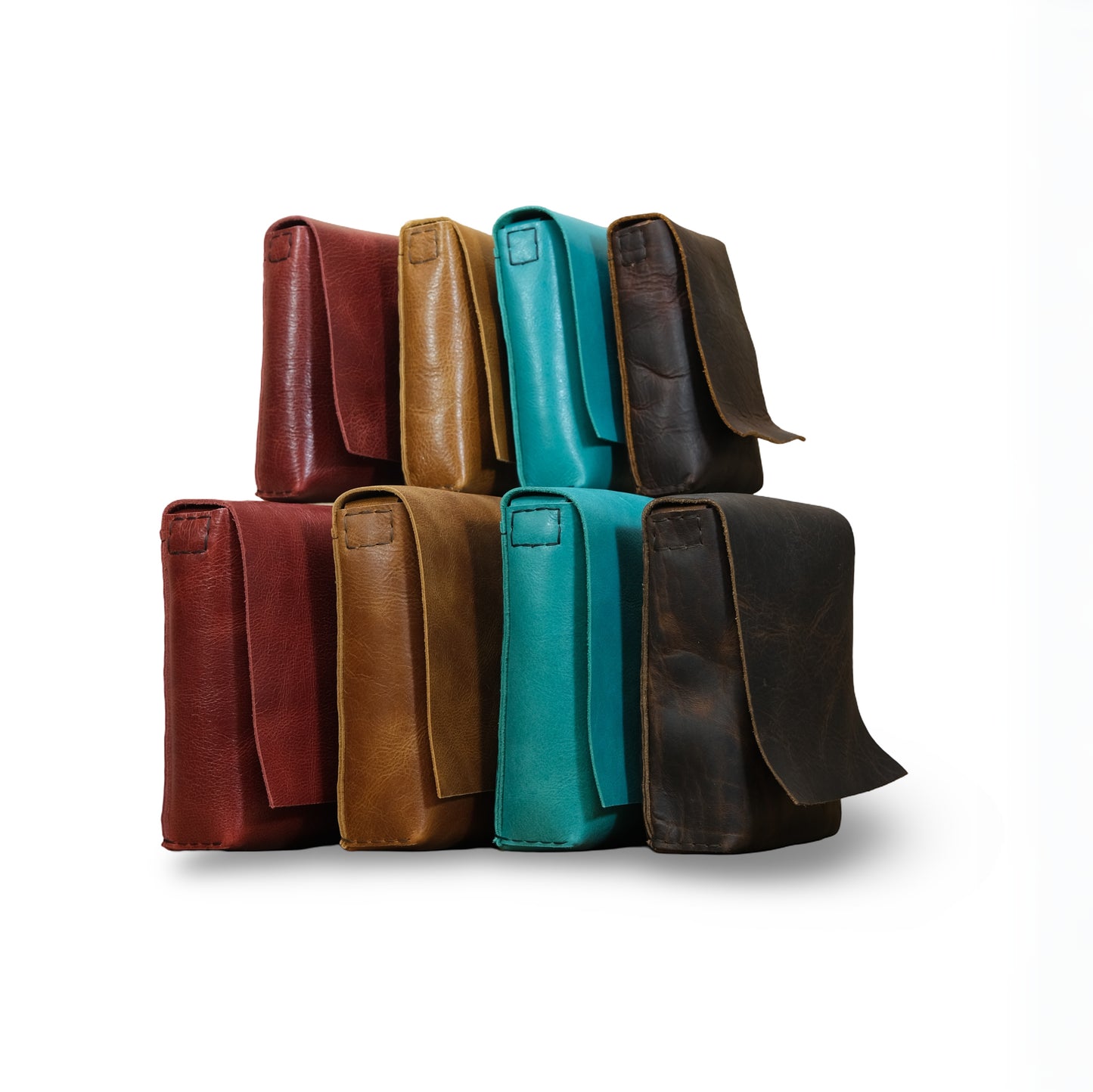 Eight Fold leather crossbody bags in Bordeaux, Canyon Tan Turquoise, and Bison Brown arranged together.